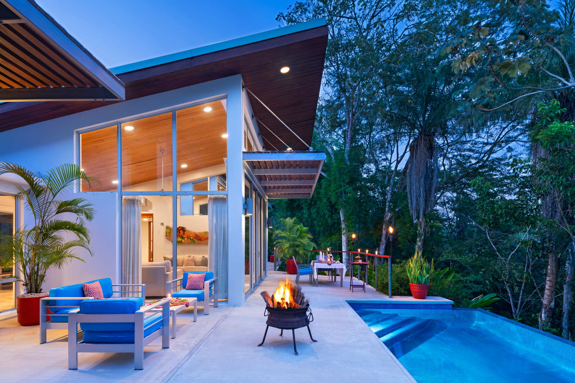 Exterior view of the Ix Chel Villa at The Lodge at Chaa Creek in Belize, surrounded by tropical gardens